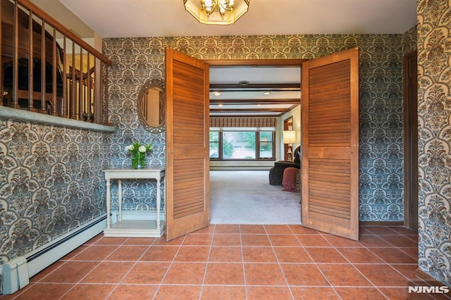 526 Cleveland Ave, River Vale, NJ 07675 - tiled foyer featuring baseboard heating, wallpapered walls, and a chandelier