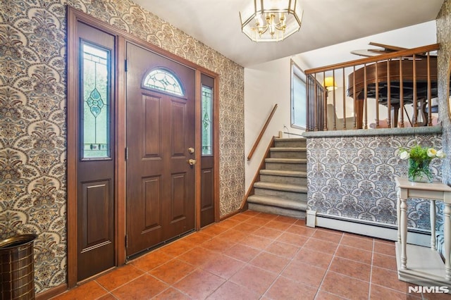 526 Cleveland Ave, River Vale, NJ 07675 - tiled foyer entrance featuring wallpapered walls, stairway, baseboards, baseboard heating, and a chandelier