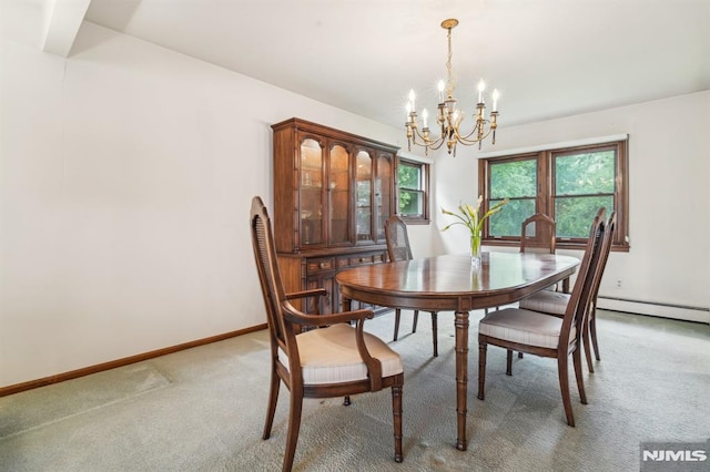 526 Cleveland Ave, River Vale, NJ 07675 - dining room featuring a chandelier, light carpet, and baseboards