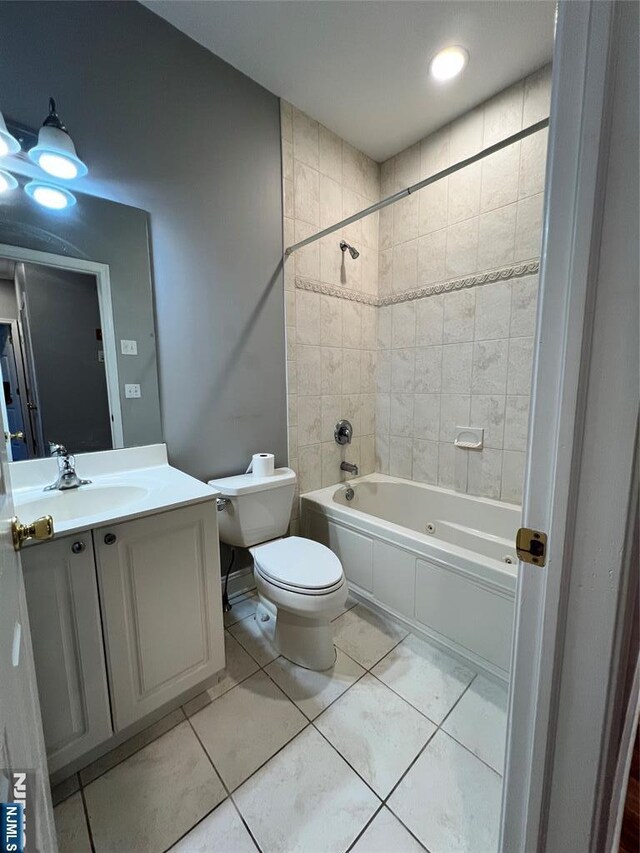 107 Hawthorne Ave Unit D, Park Ridge, NJ 07656 - bathroom with toilet, vanity, a combined bath / shower with jetted tub, and tile patterned flooring