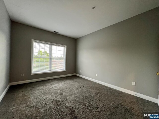 107 Hawthorne Ave Unit D, Park Ridge, NJ 07656 - carpeted empty room featuring baseboards and a pendent fire sprinkler