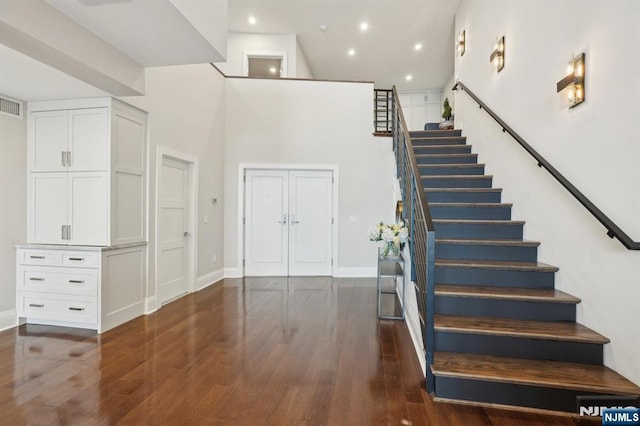 1360 Hamburg Tpke Unit 702, Wayne, NJ 07470 - staircase with hardwood / wood-style flooring, baseboards, a towering ceiling, and recessed lighting