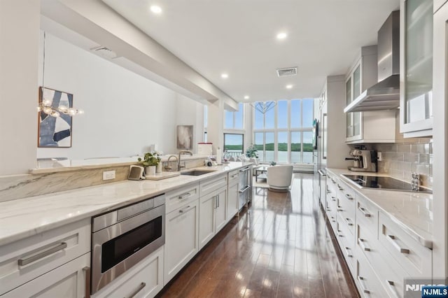 1360 Hamburg Tpke Unit 702, Wayne, NJ 07470 - kitchen with appliances with stainless steel finishes, a sink, light stone countertops, a water view, and decorative backsplash