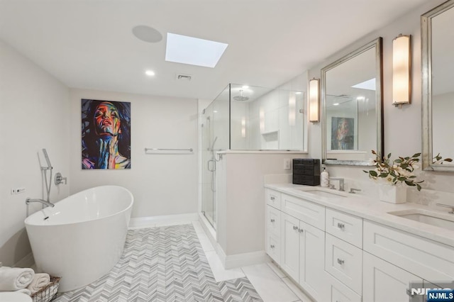 1360 Hamburg Tpke Unit 702, Wayne, NJ 07470 - bathroom with a shower stall, a skylight, double vanity, a soaking tub, and baseboards