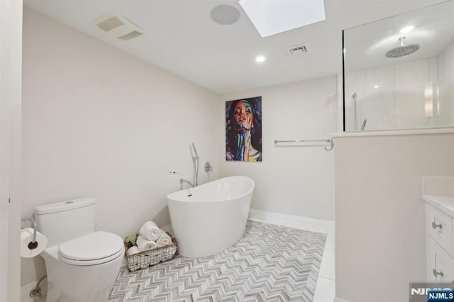 1360 Hamburg Tpke Unit 702, Wayne, NJ 07470 - full bathroom featuring a freestanding tub, a skylight, vanity, a walk in shower, and toilet