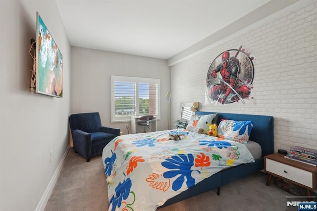 1360 Hamburg Tpke Unit 702, Wayne, NJ 07470 - carpeted bedroom with brick wall and baseboards