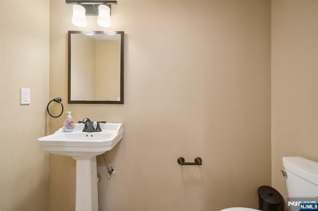 21 Albert Ave, Fair Lawn, NJ 07410 - half bath featuring toilet and a sink