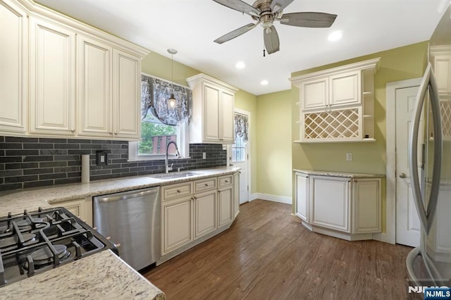 21 Albert Ave, Fair Lawn, NJ 07410 - kitchen with appliances with stainless steel finishes, a sink, a ceiling fan, tasteful backsplash, and wood finished floors