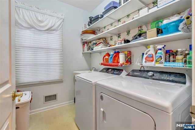  - washroom with washer and clothes dryer and baseboards