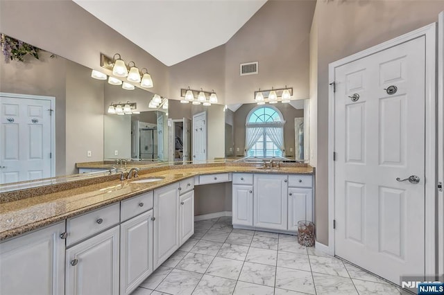  - bathroom featuring marble look tile flooring, double vanity, high vaulted ceiling, baseboards, and a shower