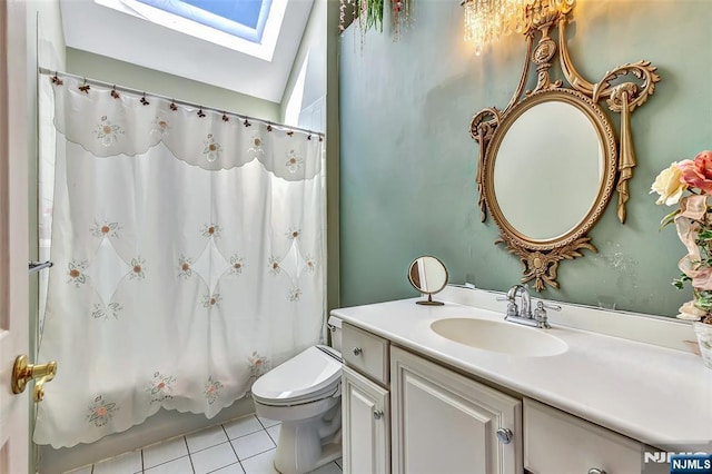  - full bath featuring a skylight, tile patterned flooring, toilet, vanity, and shower / tub combo with curtain