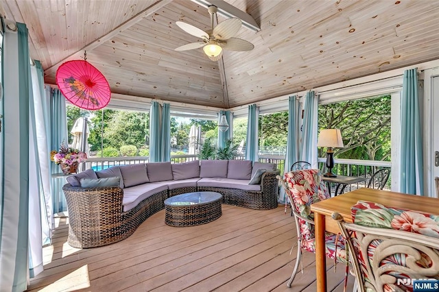  - sunroom / solarium with an outdoor hangout area, vaulted ceiling, a ceiling fan, and plenty of natural light