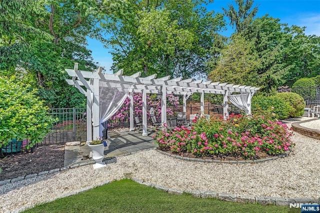  - gate with a pergola and a patio area