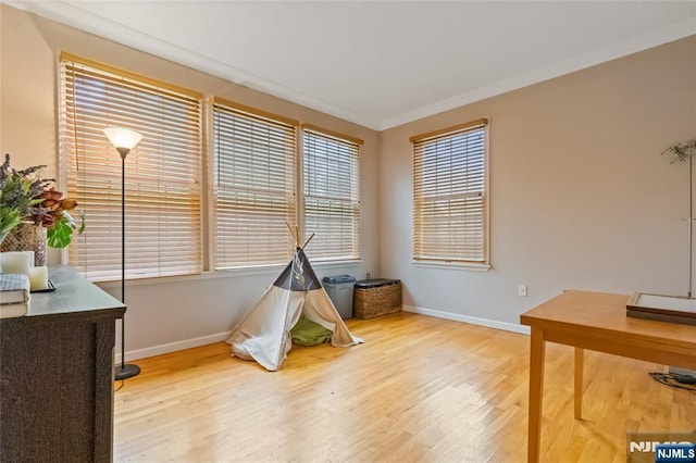40 Upsala Ct, East Orange, NJ 07017 - game room featuring baseboards, wood finished floors, and crown molding