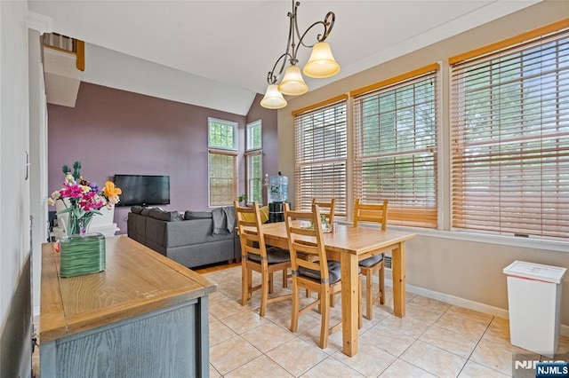 40 Upsala Ct, East Orange, NJ 07017 - dining area featuring light tile patterned floors, lofted ceiling, and baseboards