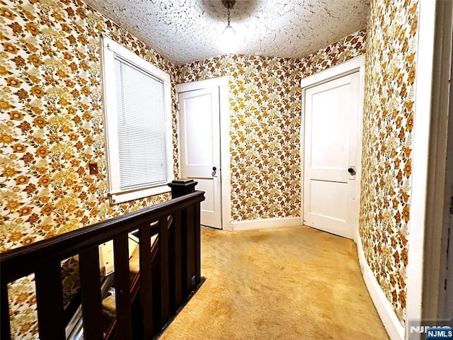 128 Oak Ridge Ave, Nutley, NJ 07110 - hallway featuring wallpapered walls, light colored carpet, and baseboards