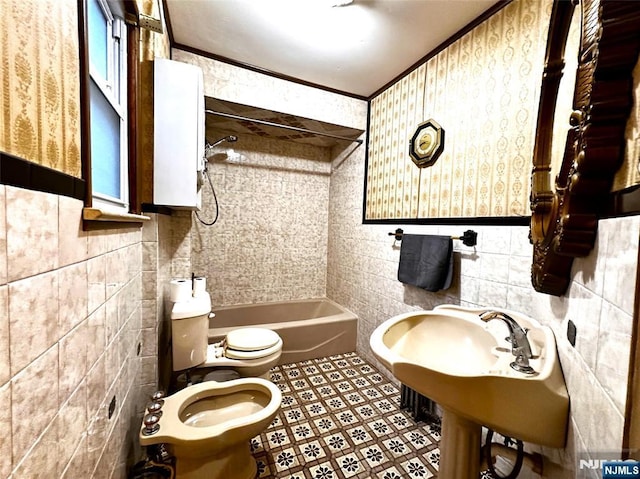128 Oak Ridge Ave, Nutley, NJ 07110 - full bathroom featuring toilet, tile walls, a bidet, shower / bathtub combination, and ornamental molding