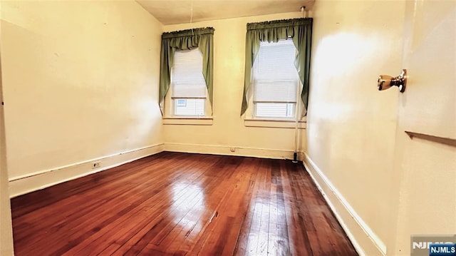 128 Oak Ridge Ave, Nutley, NJ 07110 - empty room featuring dark wood-style flooring and baseboards