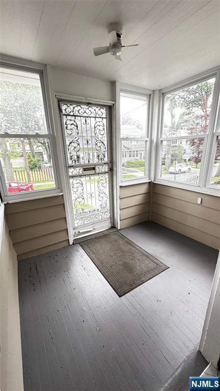 128 Oak Ridge Ave, Nutley, NJ 07110 - unfurnished sunroom with a ceiling fan