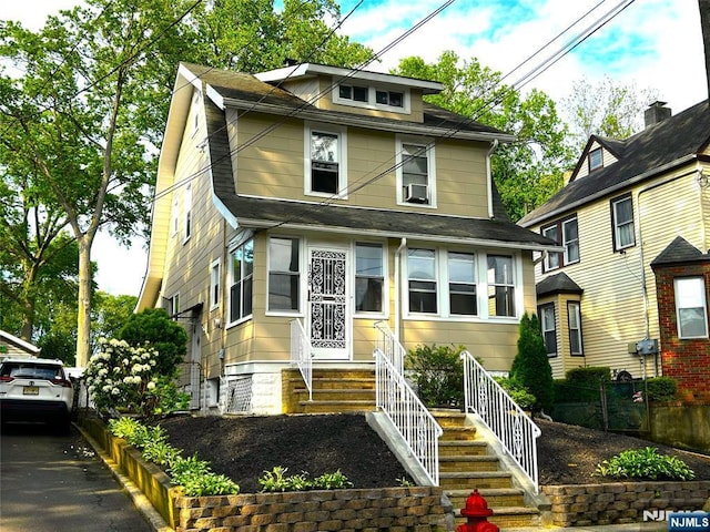 128 Oak Ridge Ave, Nutley, NJ 07110 - american foursquare style home featuring roof with shingles