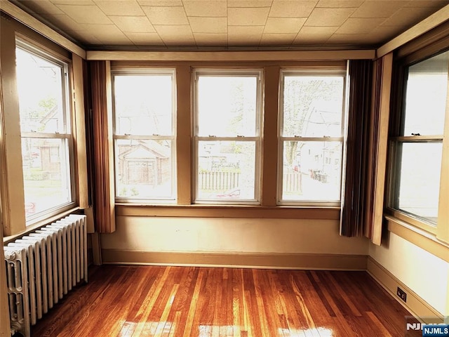 128 Oak Ridge Ave, Nutley, NJ 07110 - unfurnished sunroom featuring radiator heating unit