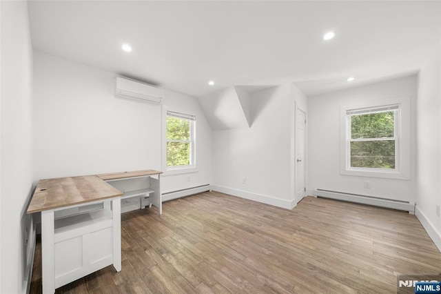 93 Stelfox St, Demarest, NJ 07627 - additional living space with a baseboard heating unit, an AC wall unit, wood finished floors, recessed lighting, and baseboards