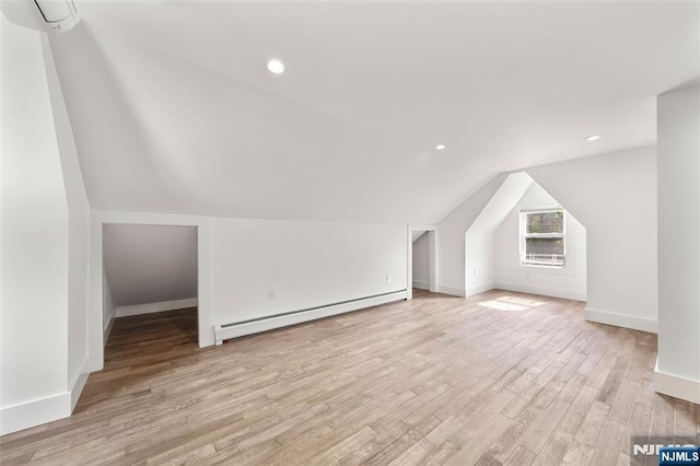 93 Stelfox St, Demarest, NJ 07627 - additional living space with baseboard heating, lofted ceiling, light wood-type flooring, baseboards, and recessed lighting