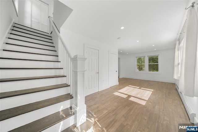 93 Stelfox St, Demarest, NJ 07627 - stairway with wood finished floors, recessed lighting, a baseboard radiator, and baseboards