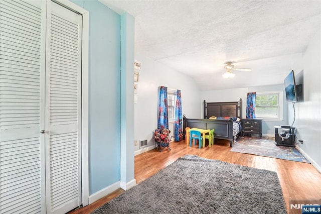 26 Howard Pl, Waldwick, NJ 07463 - bedroom with a textured ceiling, wood finished floors, baseboards, a closet, and ceiling fan
