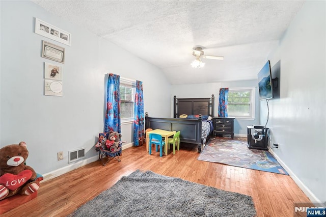 26 Howard Pl, Waldwick, NJ 07463 - bedroom featuring a textured ceiling, wood finished floors, baseboards, lofted ceiling, and ceiling fan
