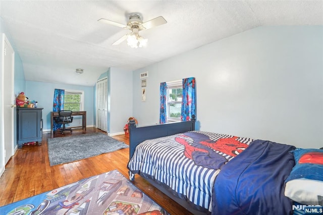 26 Howard Pl, Waldwick, NJ 07463 - bedroom featuring wood finished floors, vaulted ceiling, a closet, ceiling fan, and a textured ceiling