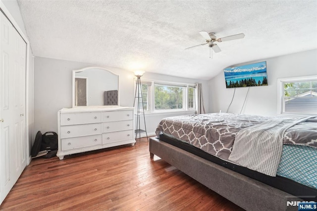 26 Howard Pl, Waldwick, NJ 07463 - bedroom with vaulted ceiling, wood finished floors, a textured ceiling, ceiling fan, and a closet
