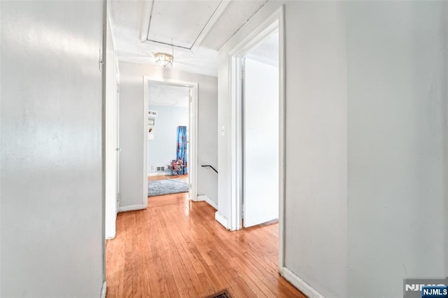 26 Howard Pl, Waldwick, NJ 07463 - hallway featuring attic access, light wood-type flooring, an upstairs landing, and baseboards