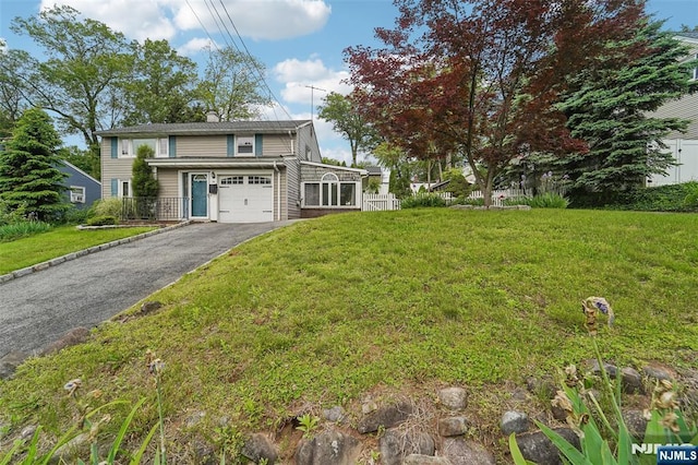 26 Howard Pl, Waldwick, NJ 07463 - traditional-style house featuring a garage and driveway
