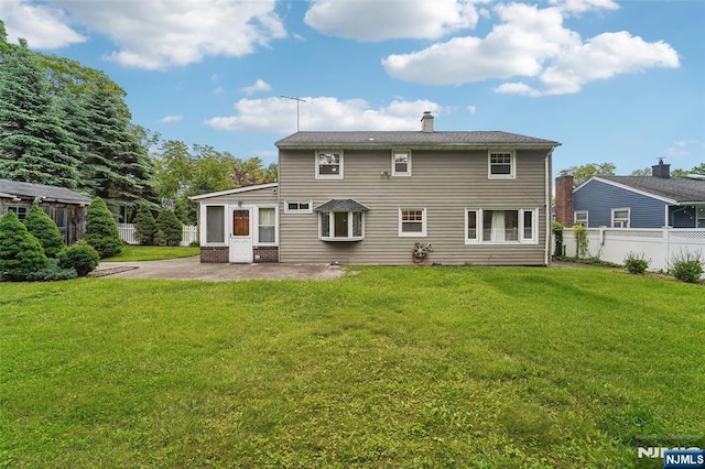 26 Howard Pl, Waldwick, NJ 07463 - rear view of property featuring a patio and a chimney