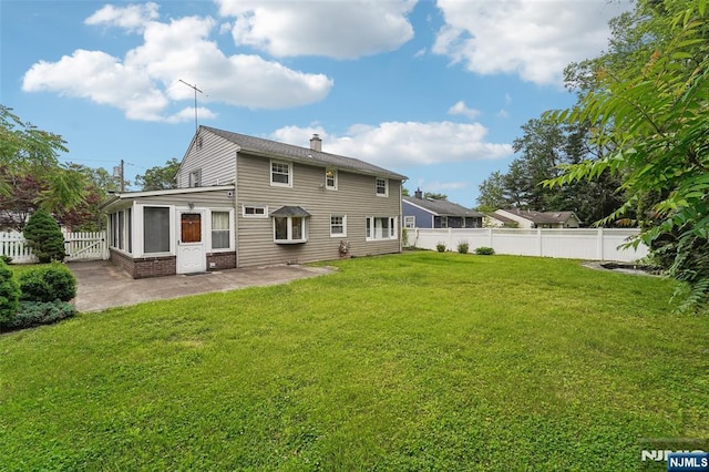 26 Howard Pl, Waldwick, NJ 07463 - back of property featuring a patio, a chimney, and brick siding