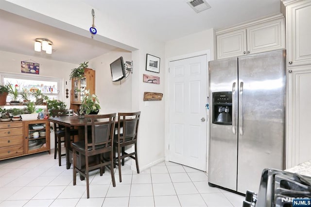 1154 Summit Ave, Teaneck, NJ 07666 - dining area with light tile patterned flooring and baseboards