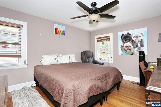 1154 Summit Ave, Teaneck, NJ 07666 - bedroom with baseboards, wood finished floors, and a ceiling fan