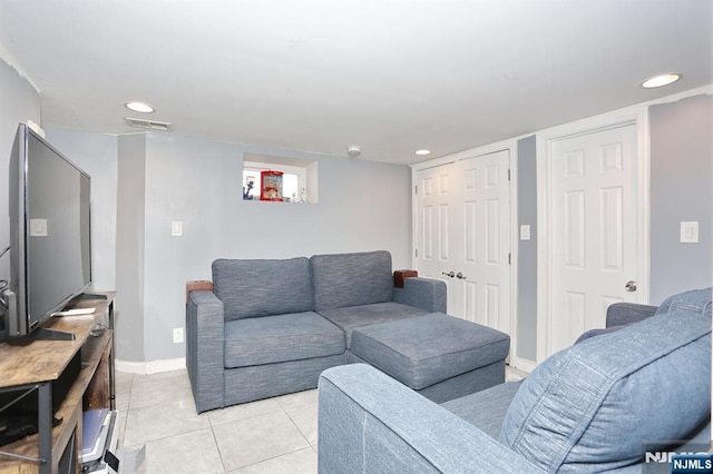 1154 Summit Ave, Teaneck, NJ 07666 - living area with light tile patterned floors, recessed lighting, and baseboards