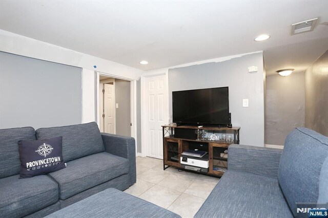 1154 Summit Ave, Teaneck, NJ 07666 - living room with light tile patterned floors and recessed lighting