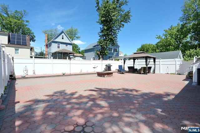 1154 Summit Ave, Teaneck, NJ 07666 - fenced backyard featuring a gazebo and a patio area