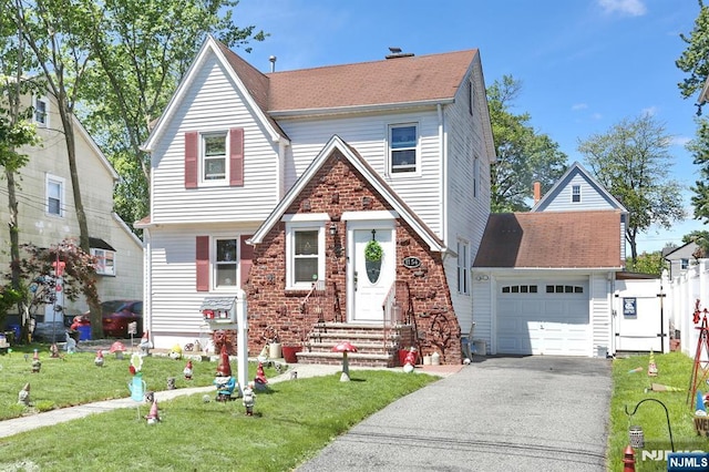 1154 Summit Ave, Teaneck, NJ 07666 - view of front of property with driveway, a front yard, and entry steps