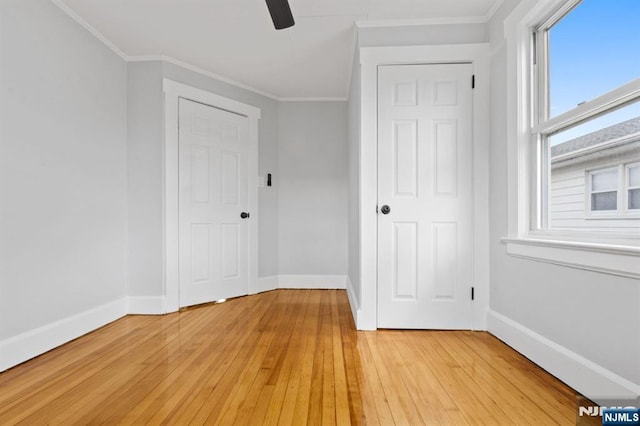 49 Oakwood Ave, Bloomfield, NJ 07003 - unfurnished bedroom featuring light wood-style floors, baseboards, crown molding, and a ceiling fan