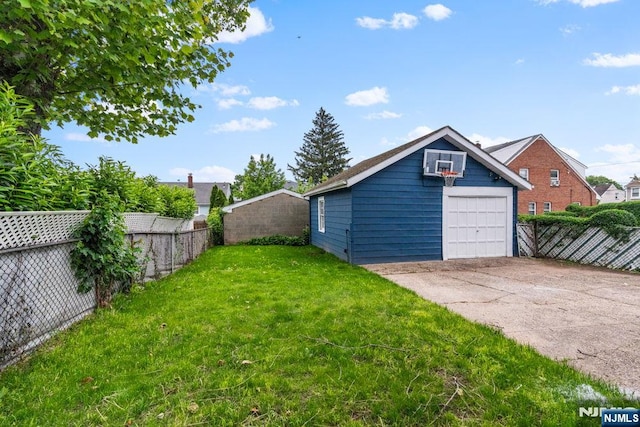 49 Oakwood Ave, Bloomfield, NJ 07003 - view of yard featuring concrete driveway, a garage, and an outdoor structure