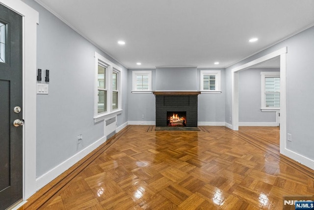 49 Oakwood Ave, Bloomfield, NJ 07003 - unfurnished living room featuring a brick fireplace, baseboards, and recessed lighting