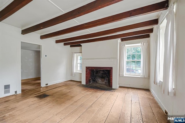 58 Maple Ave, Montville Township, NJ 07058 - unfurnished living room featuring light wood-type flooring, beam ceiling, healthy amount of natural light, a fireplace with flush hearth, and baseboards