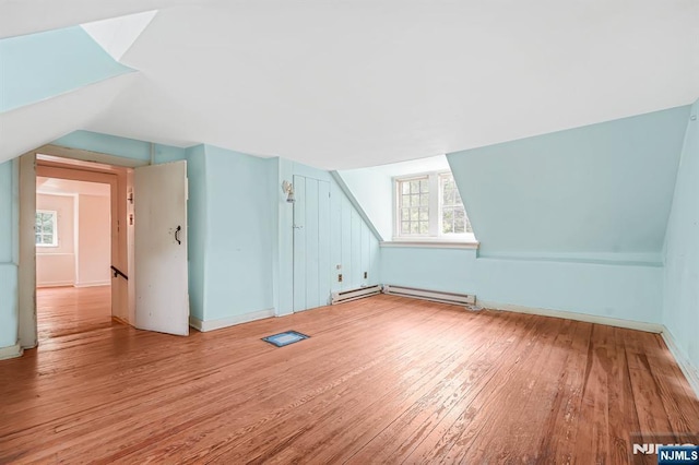 58 Maple Ave, Montville Township, NJ 07058 - bonus room with light wood-type flooring, healthy amount of natural light, vaulted ceiling, and baseboards