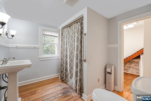 58 Maple Ave, Montville Township, NJ 07058 - bathroom featuring wood-type flooring, toilet, baseboards, a sink, and a shower with curtain