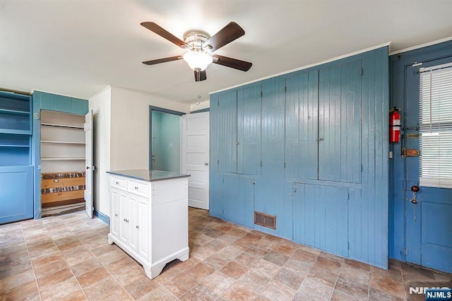 58 Maple Ave, Montville Township, NJ 07058 - unfurnished bedroom with wood walls, stone finish flooring, and a ceiling fan