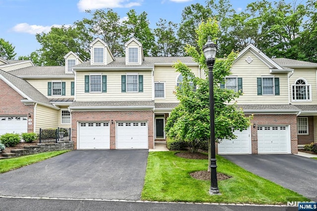 8 Pine Lake Ter Unit T008, River Vale, NJ 07675 - view of property featuring driveway, a garage, brick siding, and a front yard